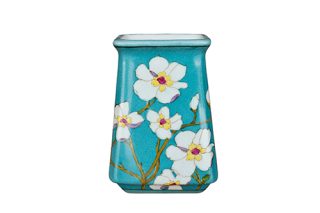 Green vase with white flowers